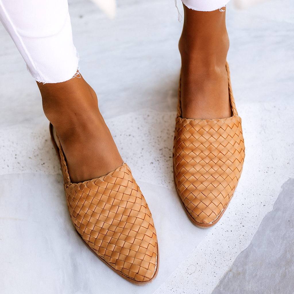 Women's stylish woven closed-toe slip-on mules for elegant casual wear.
