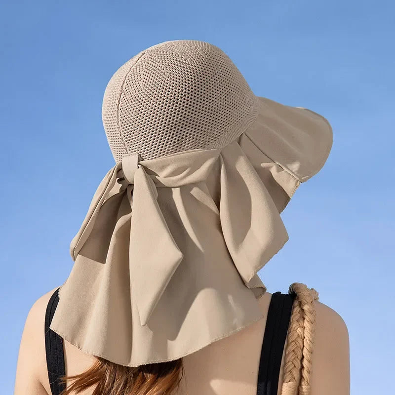 Stylish women's foldable sun hat with wide brim & detachable shawl for complete summer sun protection.