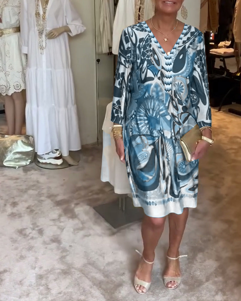 Women's retro style sunburst patterned tunic dress, comfortable and artistic for everyday wear.