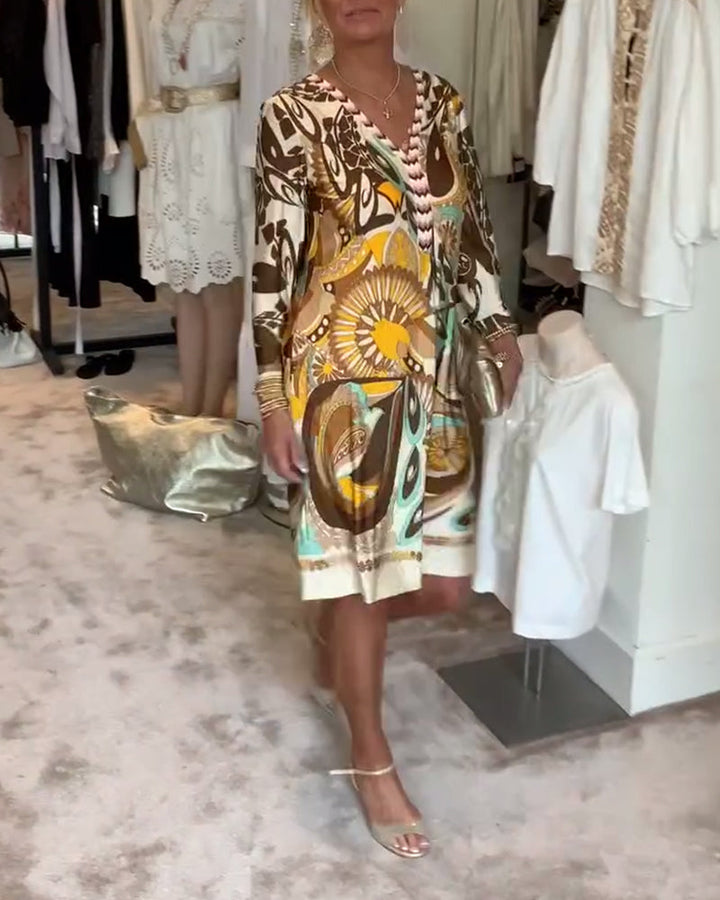 Relaxed fit women's tunic dress with a unique sunburst pattern, great for summer fashion.