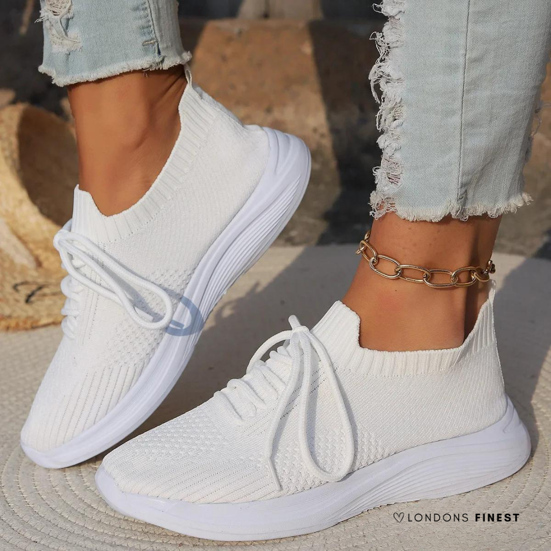 Women's supportive athletic sneakers with breathable mesh, ideal for walking & active lifestyles.