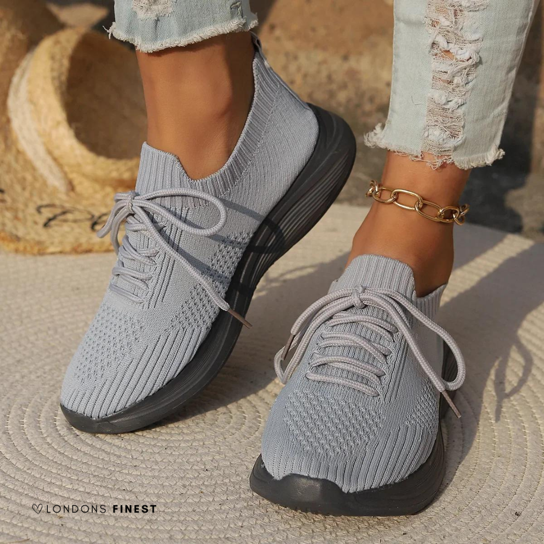 Breathable women's walking sneakers, cushioned & stable for everyday comfort & casual wear.