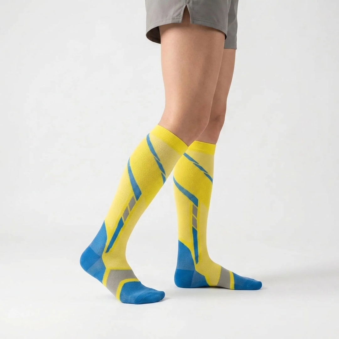 Comfortable women's knee-high athletic socks in blue, offering arch support for activewear & travel.