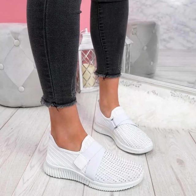 Ladies' comfortable slip-on sneakers for daily wear, featuring posture support and an adjustable fit.