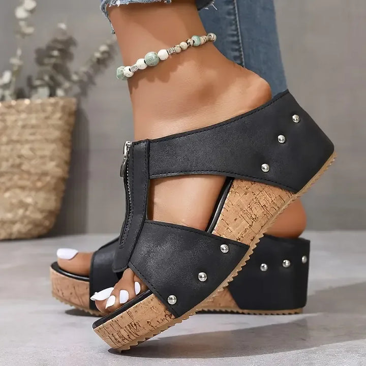Women's fashion wedge sandals featuring a contoured footbed and supportive sole for ultimate comfort.