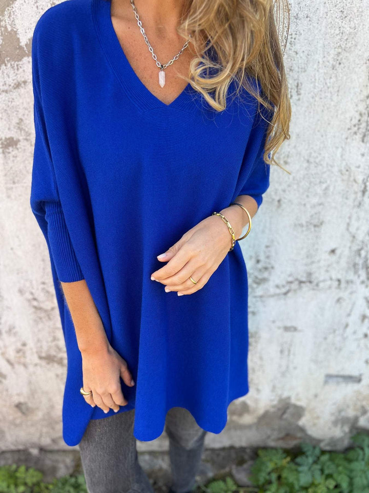 Versatile women's V-neck pullover sweater. Relaxed swing tunic with long batwing sleeves for everyday comfort.