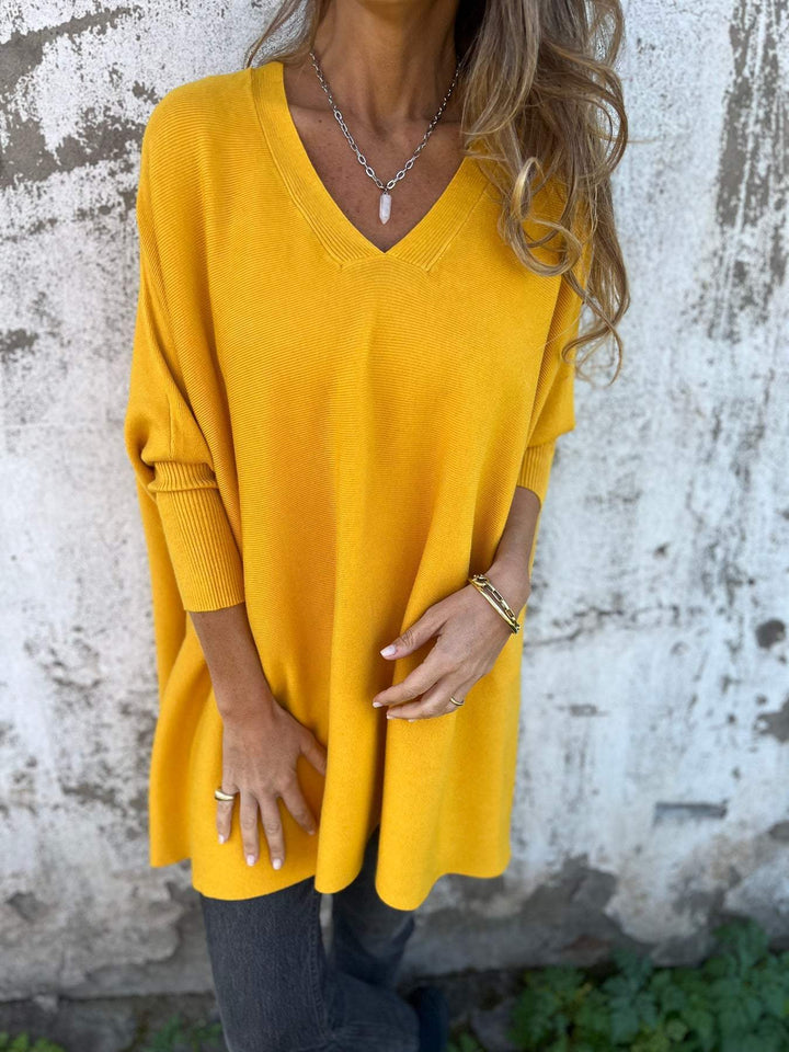 Elegant women's V-neck tunic sweater, loose swing fit & chic batwing sleeves. Perfect long sleeve pullover.