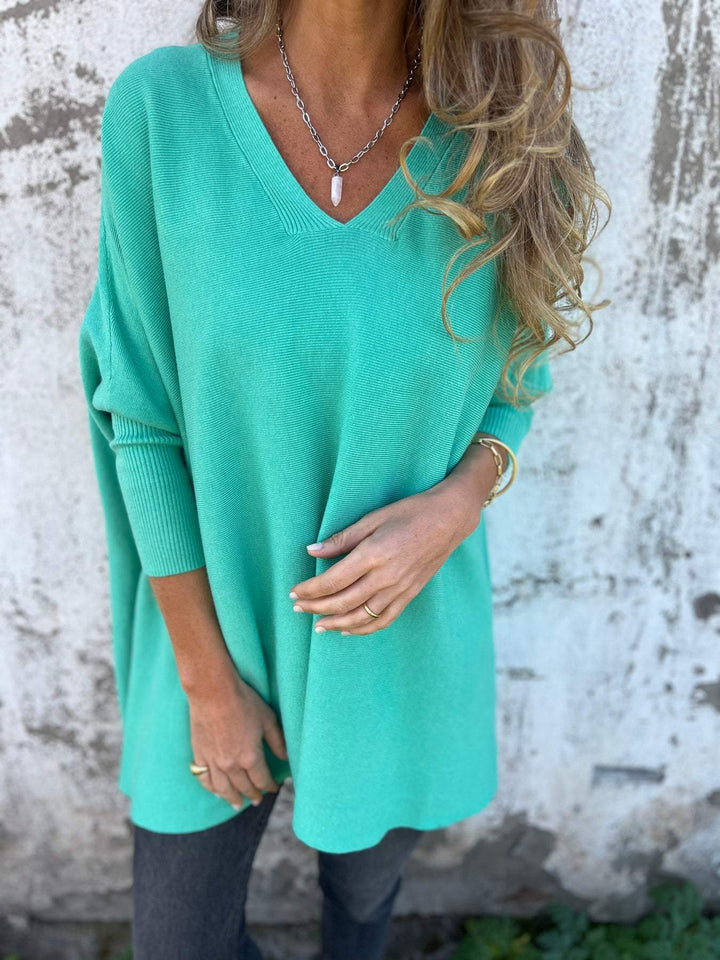 Women's comfortable V-neck swing tunic pullover sweater. Relaxed fit, long batwing sleeves, versatile everyday style.