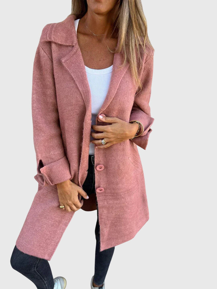 Front view of a women's button blazer, a chic tailored jacket enhancing business casual and sophisticated fashion.