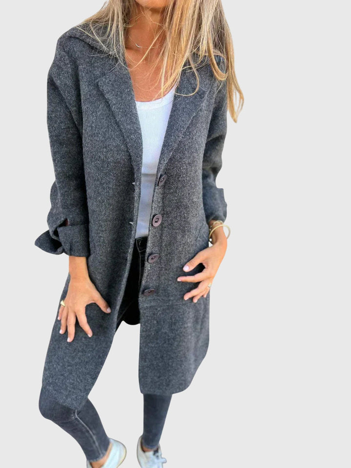 Close-up of elegant buttons on a women's tailored blazer, a chic sophisticated jacket for women's fashion.