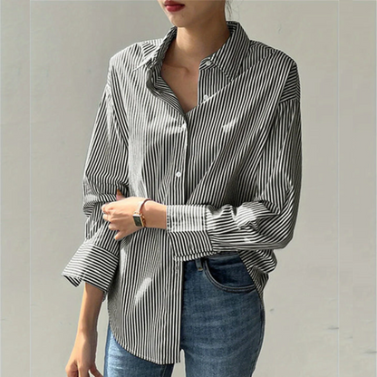 Pink women's elegant executive shirt. Tailored long-sleeve blouse for professional attire, boosting confidence at work.