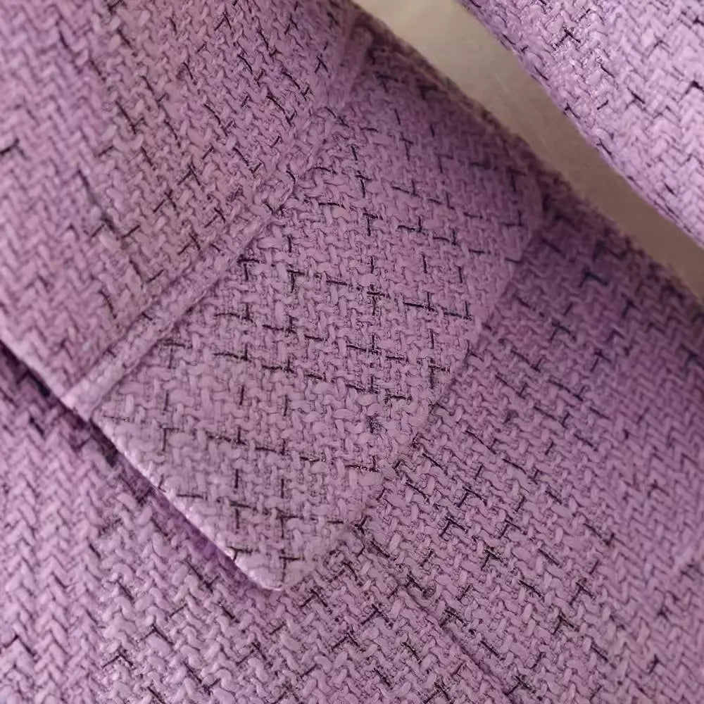 Versatile pink structured blazer, a chic long sleeve jacket for elegant office or business wear.