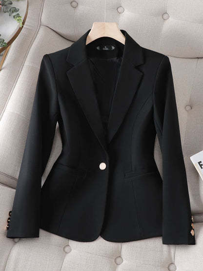 Professional women's structured blazer in a classic fit, offering an elegant edge for office or formal occasions.