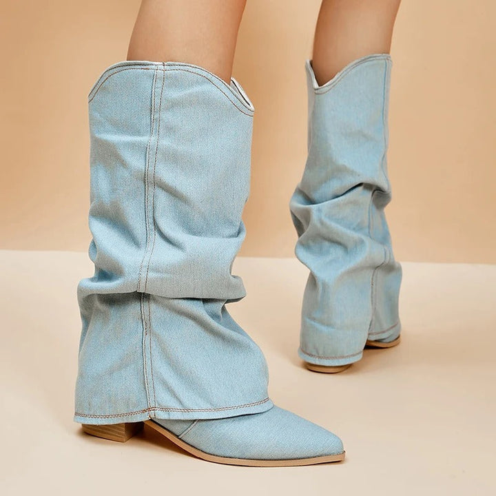 Elegant women's tall block heel boots featuring a sophisticated pleated design and sharp pointed toe.