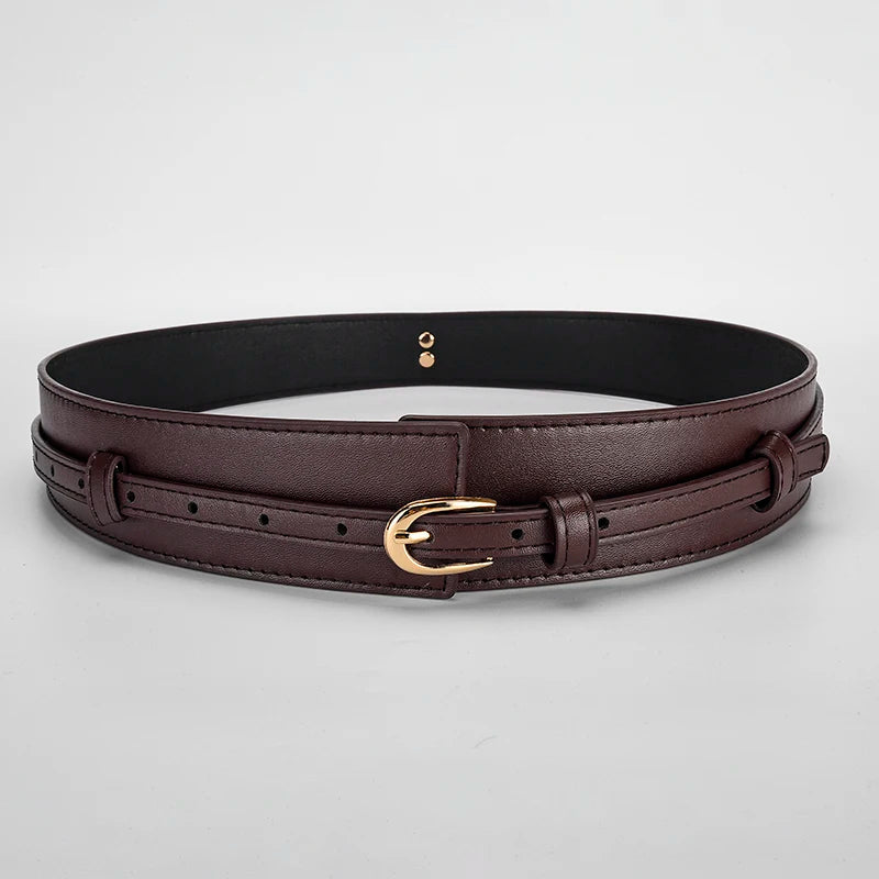 Model wearing a versatile black dual-strap vegan leather waist belt with a dress.