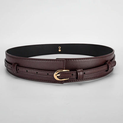 Model wearing a versatile black dual-strap vegan leather waist belt with a dress.