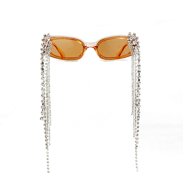 Luxurious women's sunglasses with sparkling rhinestones, flowing tassels & UV protective lenses.