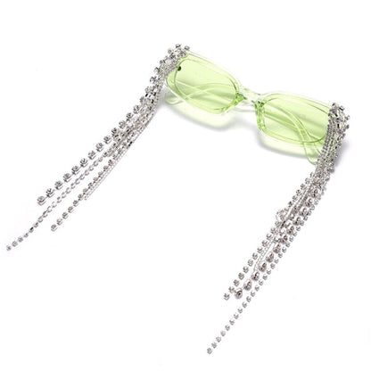 Woman wearing stylish tassel rhinestone sunglasses, enjoying UV protection & fashion eyewear.