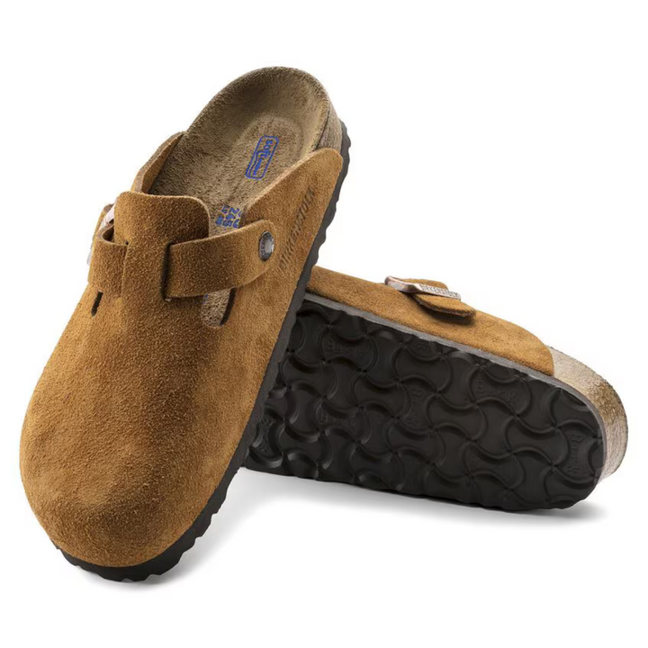 Slip-on taupe women's clogs featuring anatomical arch support and a soft cushioned footbed.