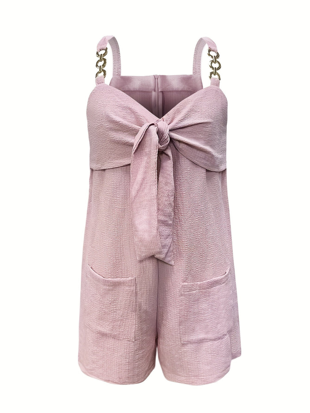 Sophisticated evening wear: black textured romper with elegant chain straps & a bow detail.