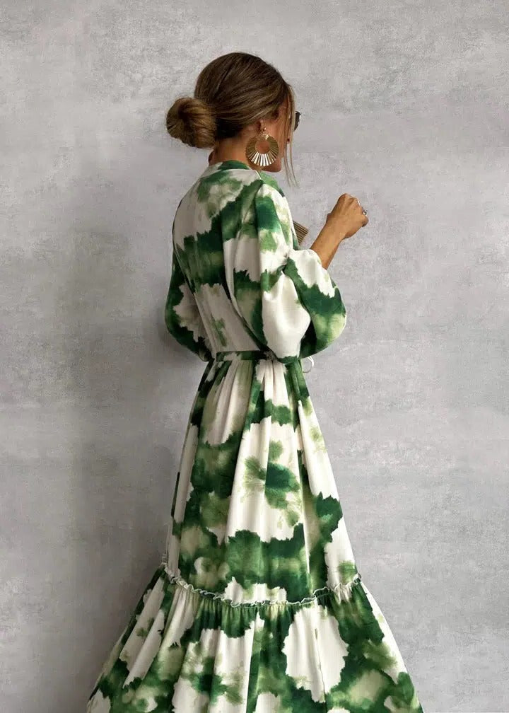Women's tie-dye belted long sleeve tiered maxi dress in flowing green print, perfect for boho summer fashion.