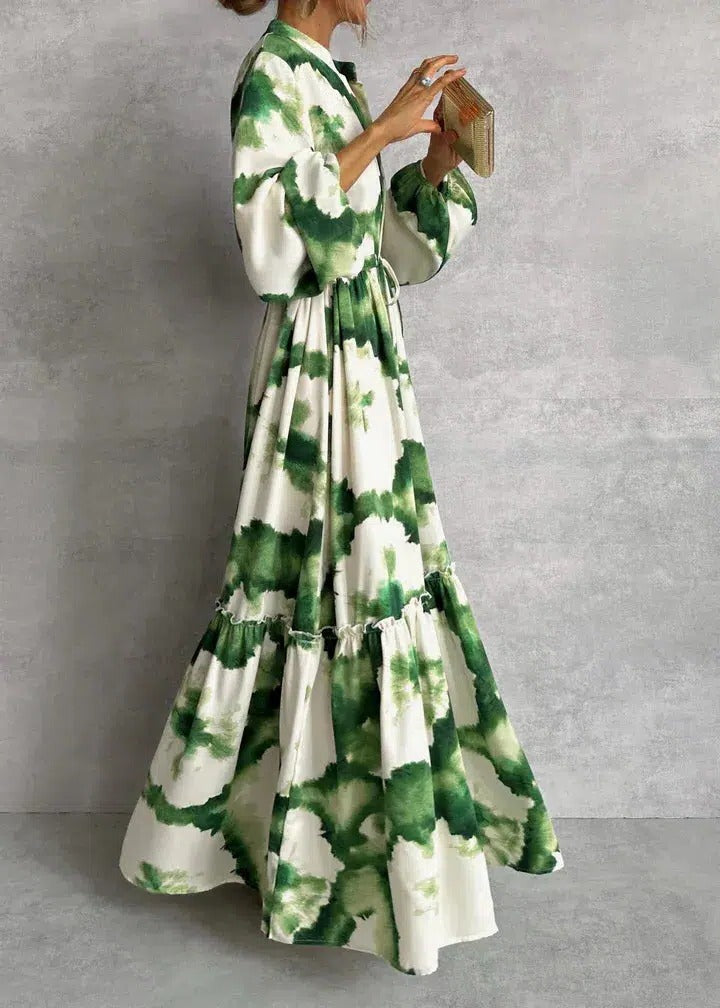 Elegant women's tie-dye maxi dress with belt & long sleeves. Tiered flowing silhouette for spring/summer style.
