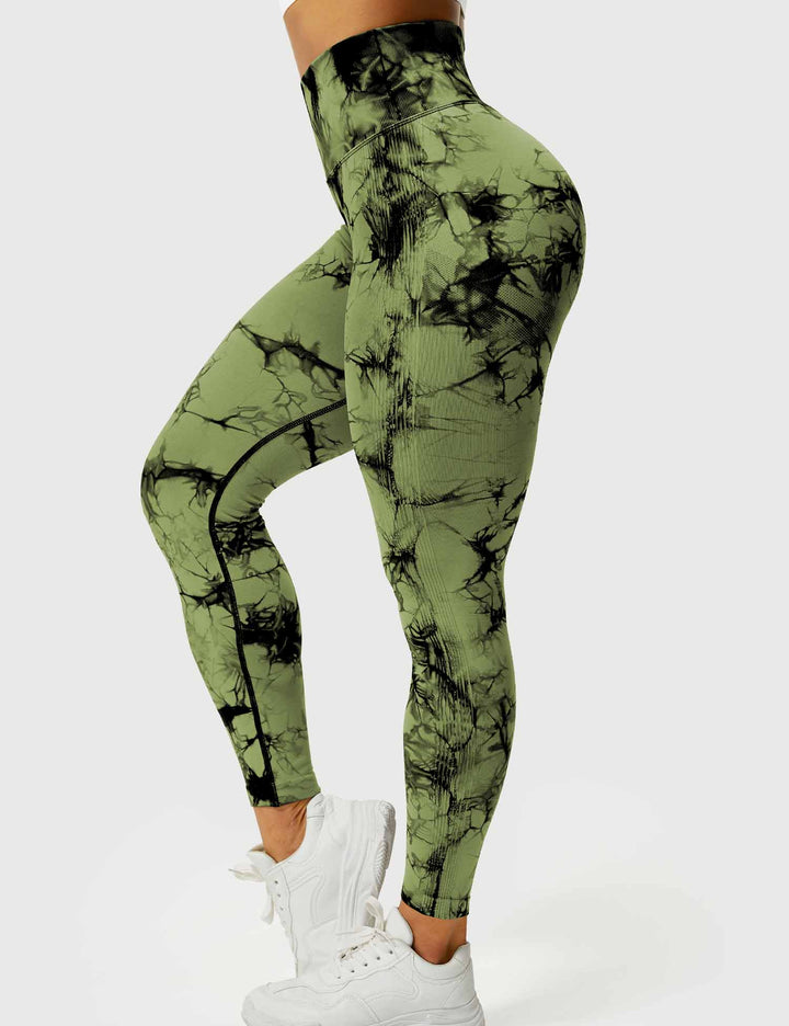 Dynamic tie-dye pattern on women's activewear leggings.