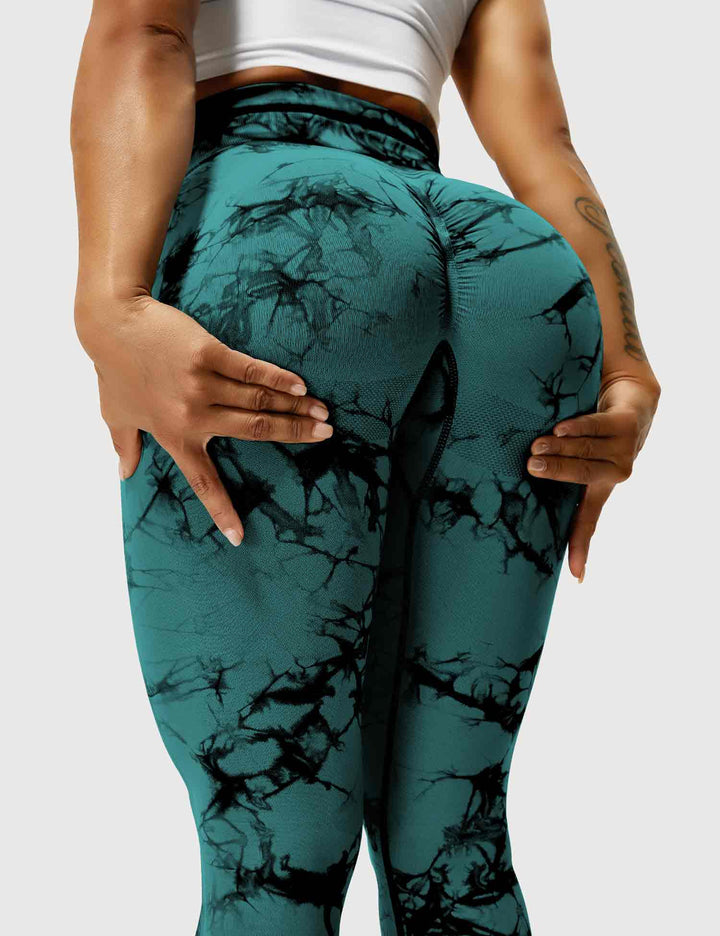 Bold tie-dye pattern on women's athletic leggings, high-waist.