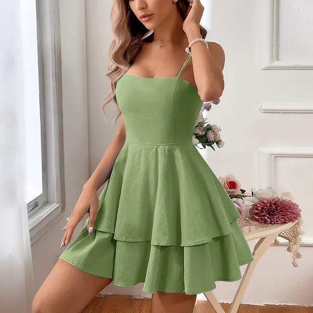 Elegant women's A-line mini cocktail dress with playful tiers and thin spaghetti straps. Event fashion.