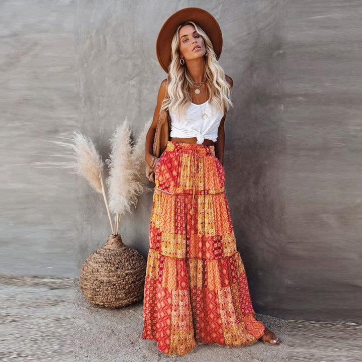 Women's tiered floral maxi skirt with a comfortable high elastic waist, perfect for summer fashion.