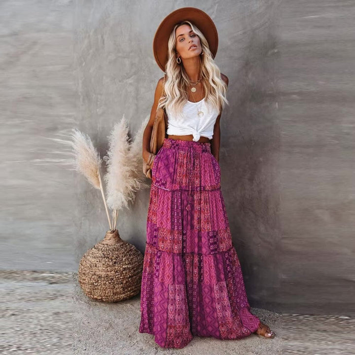 Flowing A-line tiered floral maxi skirt for women, high elastic waist, ideal for beach & vacation outfits.