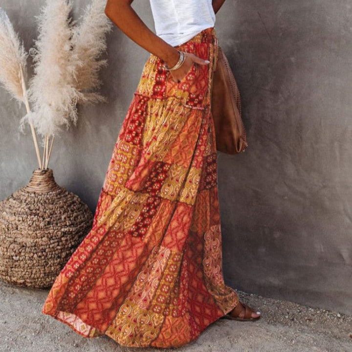 Comfortable women's tiered floral maxi skirt, high elastic waist, flowing A-line style for sunny days.