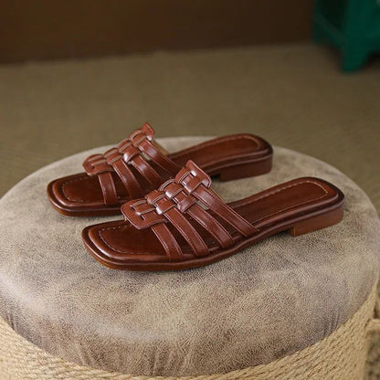 Stylish white Tivra Geo Cutout flat slide sandals for women, featuring a modern geometric design and comfort.