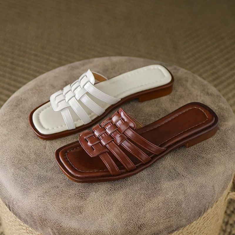 Tivra Geo Cutout women's slide sandals, featuring a stylish geometric design, cushioned comfort, and flat sole.