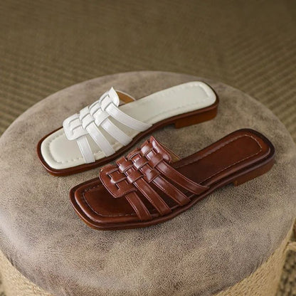 Tivra Geo Cutout women's slide sandals, featuring a stylish geometric design, cushioned comfort, and flat sole.