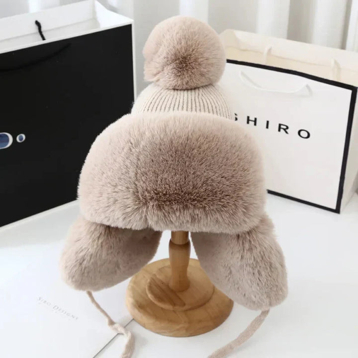 Women's Tressa ski hat with earflaps. Designed for ultimate warmth & comfort in cold winter weather.