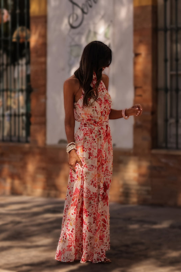 Elegant tropical halter maxi dress with a modern keyhole, stunning for resort wear & summer nights.