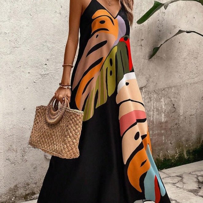 Women's tropical leaf print sleeveless maxi dress. Perfect for vacation, beach, or summer resort wear.