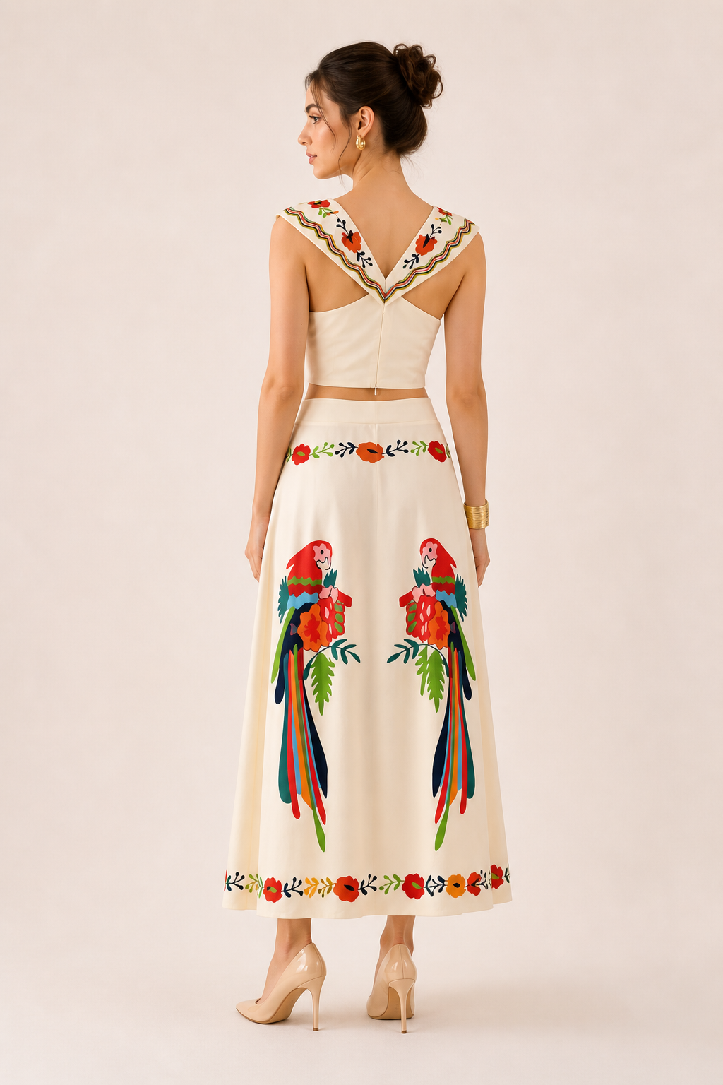 Sleeveless tropical print crop top paired with a flowing maxi skirt for women. Comfortable summer vacation set.
