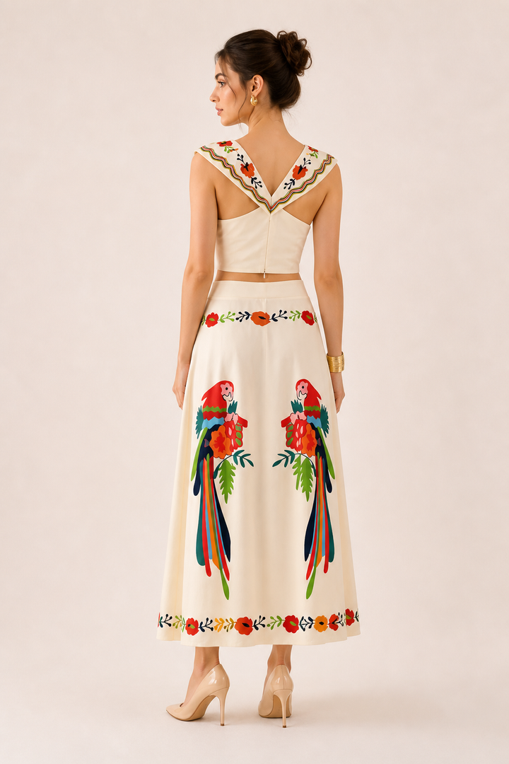 Sleeveless tropical print crop top paired with a flowing maxi skirt for women. Comfortable summer vacation set.