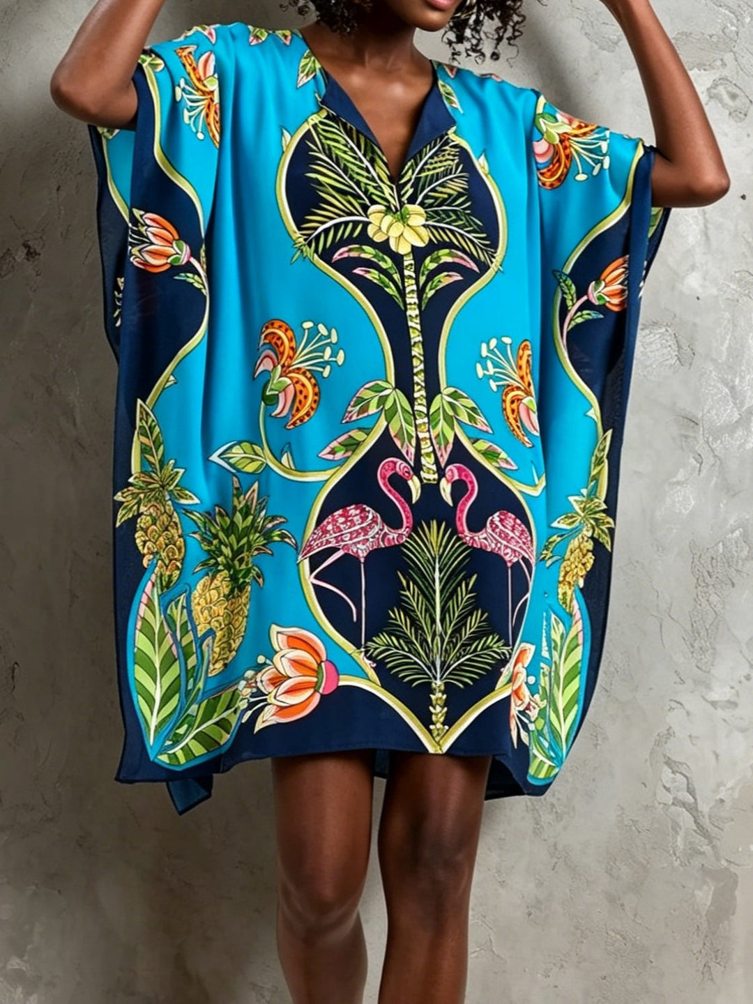 Vibrant tropical print V-neck kaftan midi dress for women, offering a relaxed and flowing resort style.