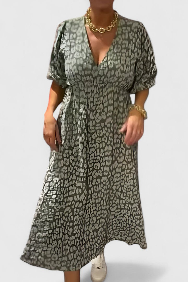 Vibrant tropical stripe maxi dress for women, featuring stylish puff sleeves and a comfortable empire waist.