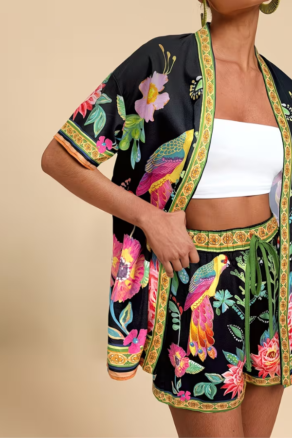 Women's matching two-piece tropical outfit with vibrant floral print, a short sleeve top & comfortable shorts.