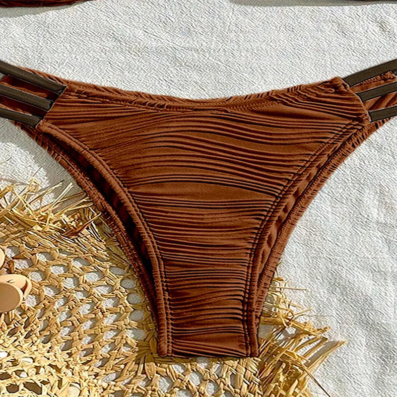 Chic women's Tulum beachwear: a ruched bandeau bikini set, perfect for summer swimming.