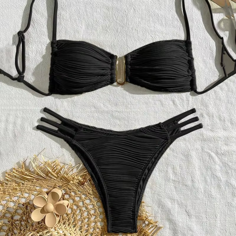 Women's stylish Tulum bikini: a ruched bandeau top and swim bottom, ideal beachwear.