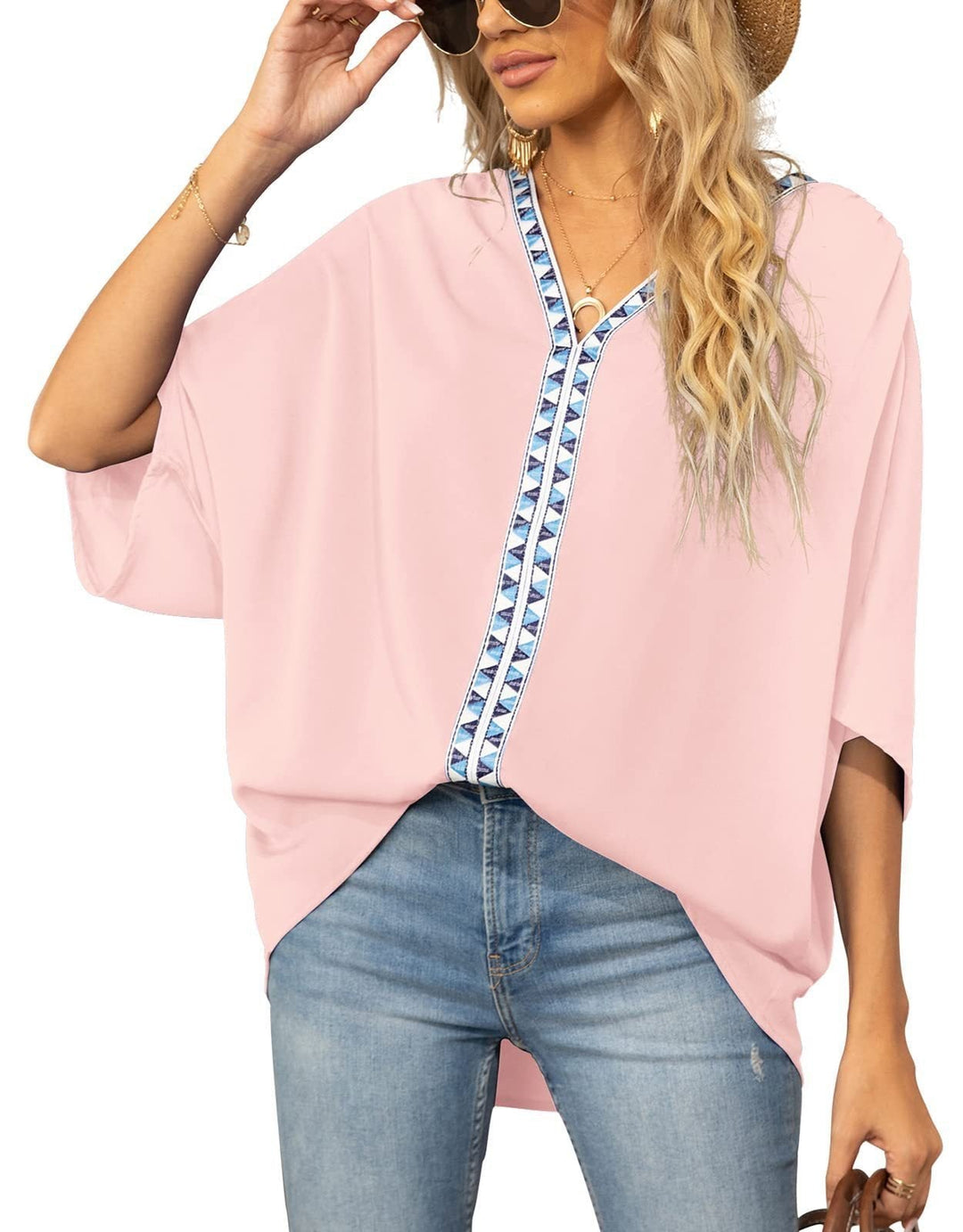 Women's tunic top with geometric V-neck trim, half sleeves, and relaxed fit. Perfect for casual boho style.