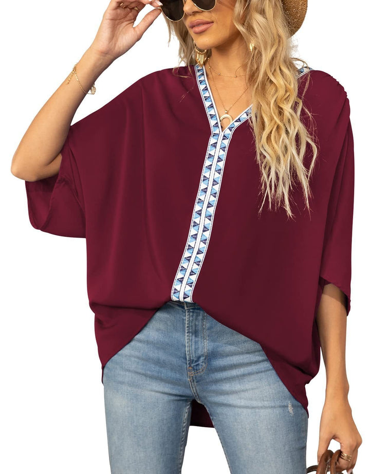 Effortless women's tunic blouse, geometric V-neck, half sleeve. Relaxed fit for spring/summer comfort.