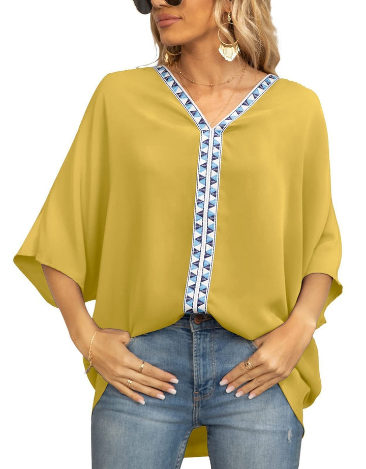 Boho style women's tunic top with geometric trim V-neck. Half sleeve, relaxed for summer outfit.