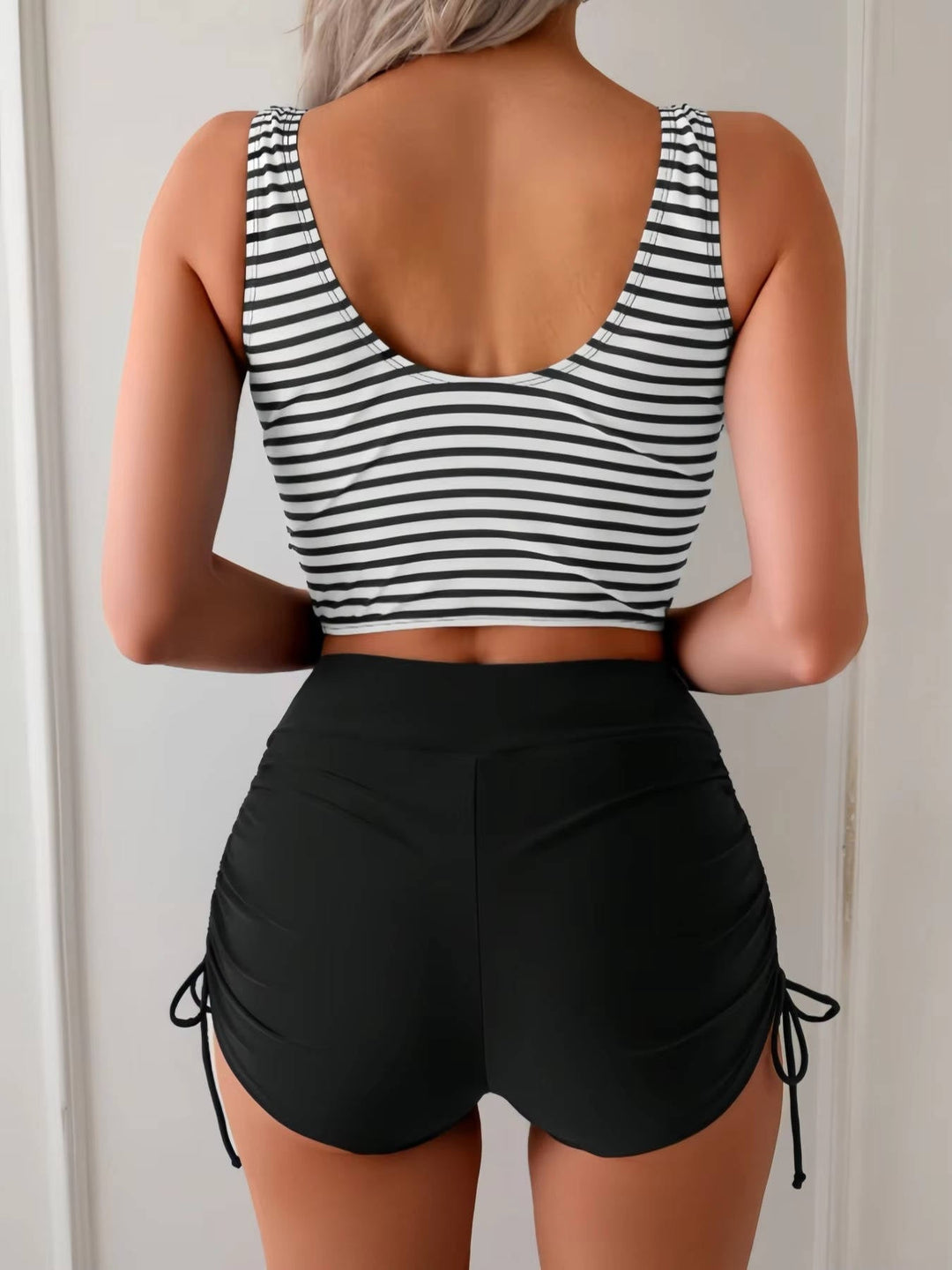 Flattering women's twist front high waisted tankini swimsuit with tummy control for beach & pool days.