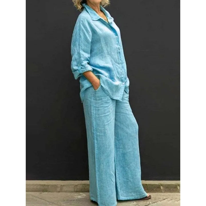 Textured women's two-piece set with elegant button-up top and wide-leg trousers, a versatile outfit.